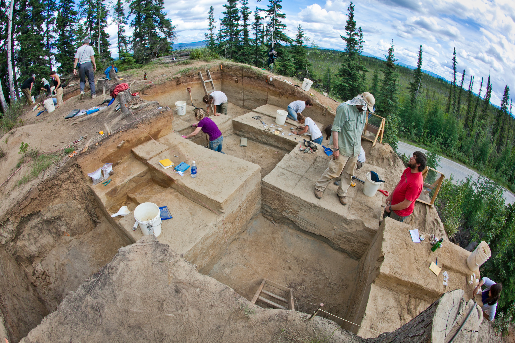 Professor Ben Potter (standing in hat) leads students participating in an archaeological field camp at the Mead site near Delta Junction as part of UAF Summer Sessions. UAF photo by Todd Paris.