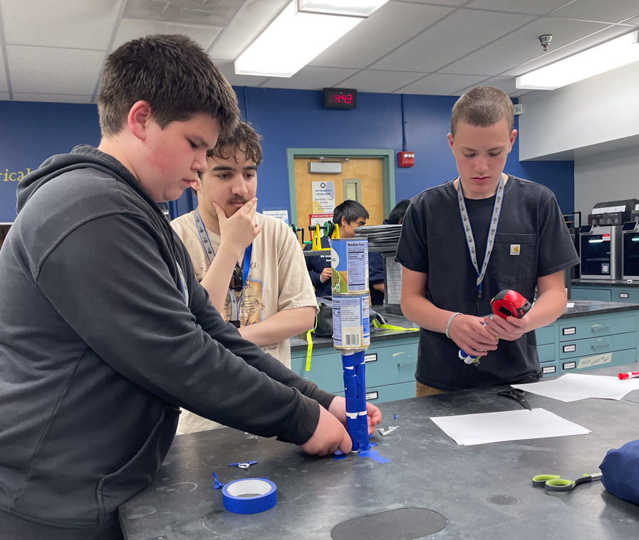 The summer session participants compete in a weight-lifting design challenge