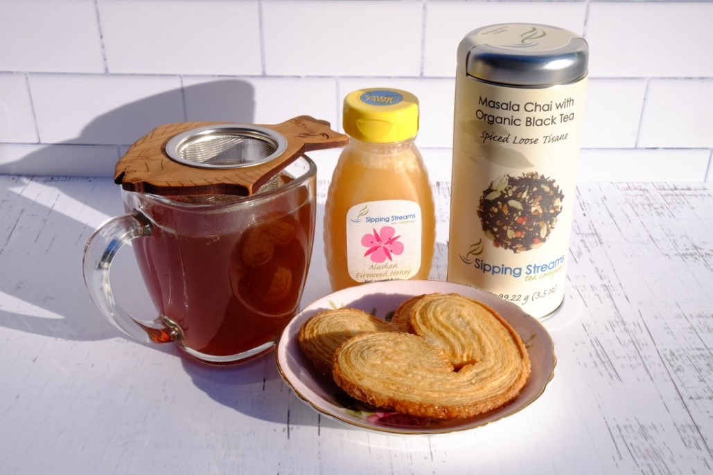 collection of tea, honey, biscuits