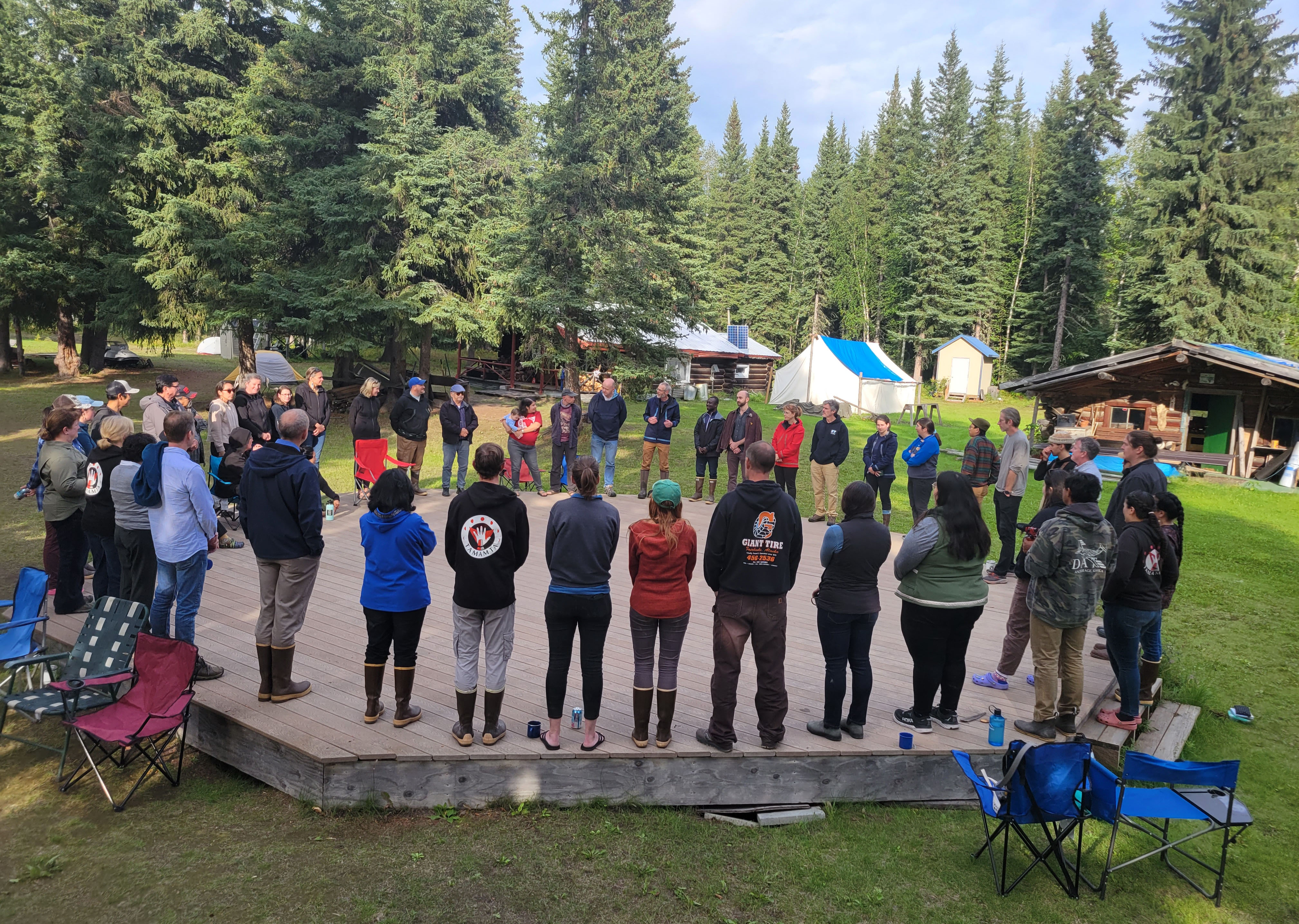 Participants in the summer 2023 Tamamta retreat hold a circle discussion at Howard Luke Gaalee’ya Spirit Camp.
