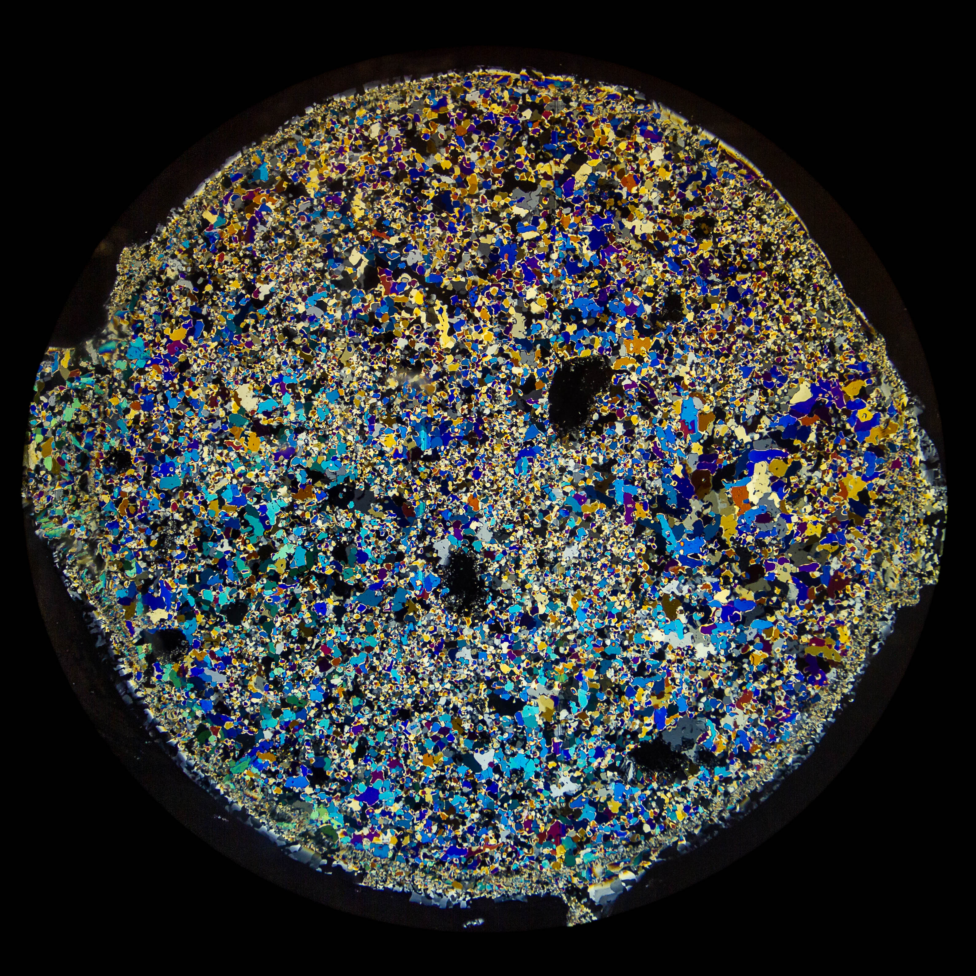 Polarized light reveals a colorful kaleidoscope of crystals in a thin section of sea ice.
