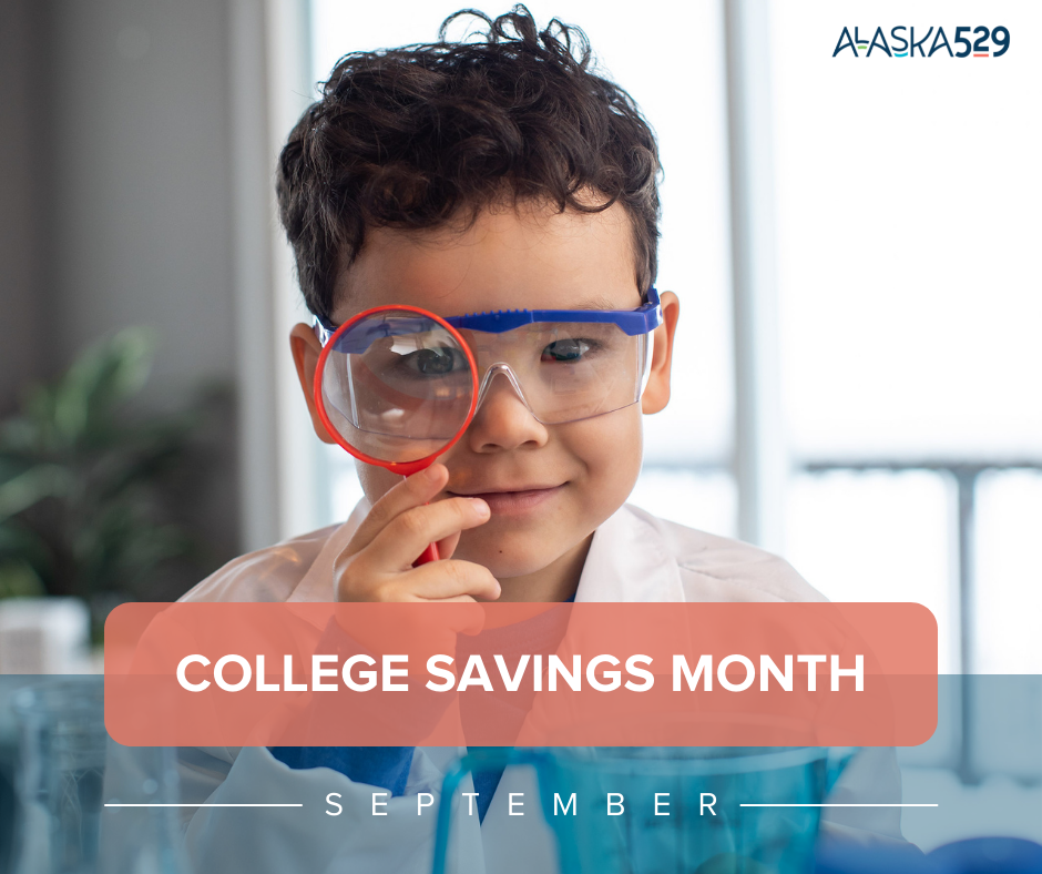 Young boy wearing safety glasses and a lab coat holding up a magnifying glass with a red banner and white text inside that states 