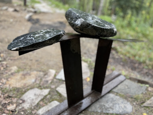 Two rocks on metal posts