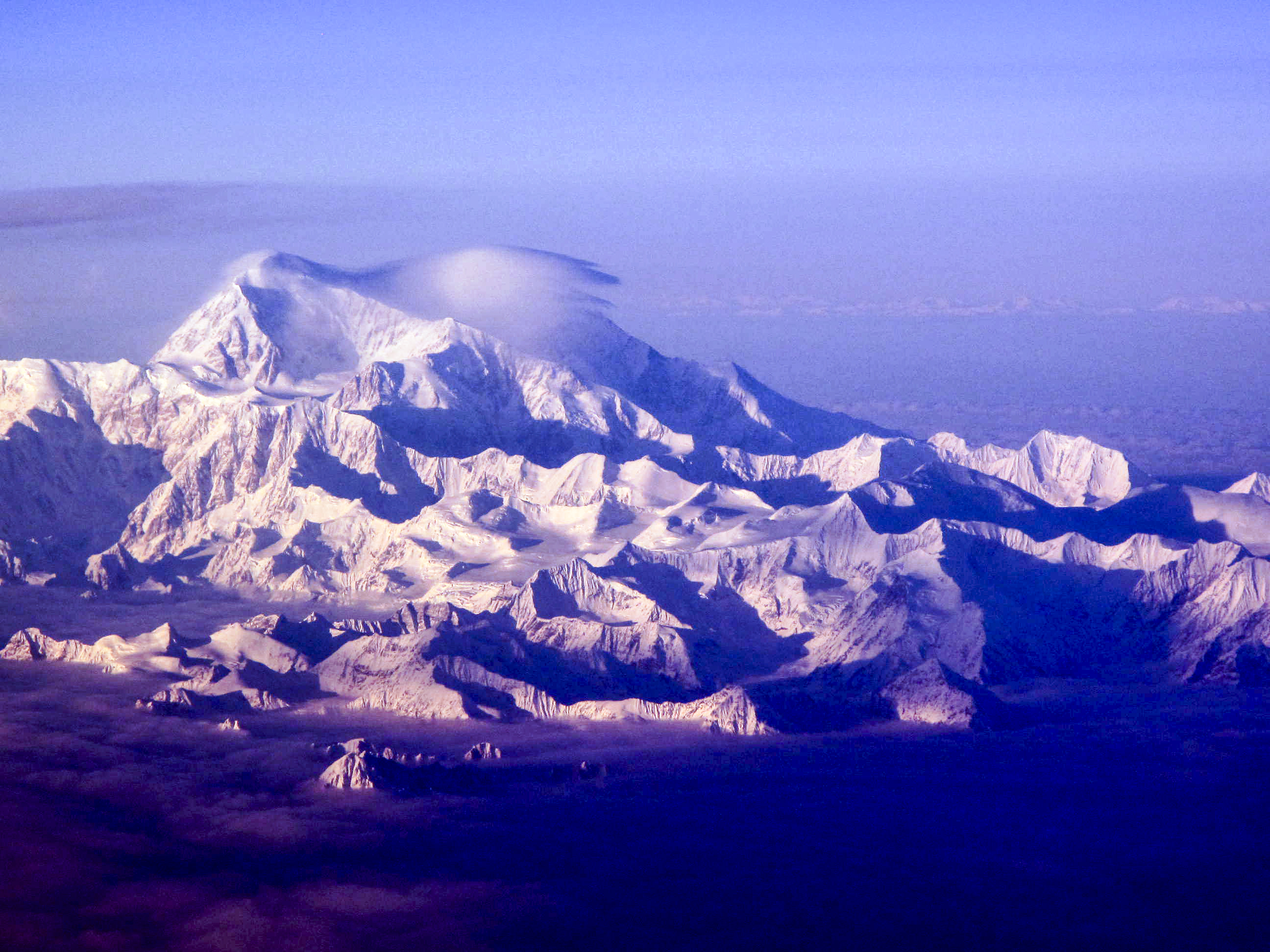 a view of Denali as seen through a plane window