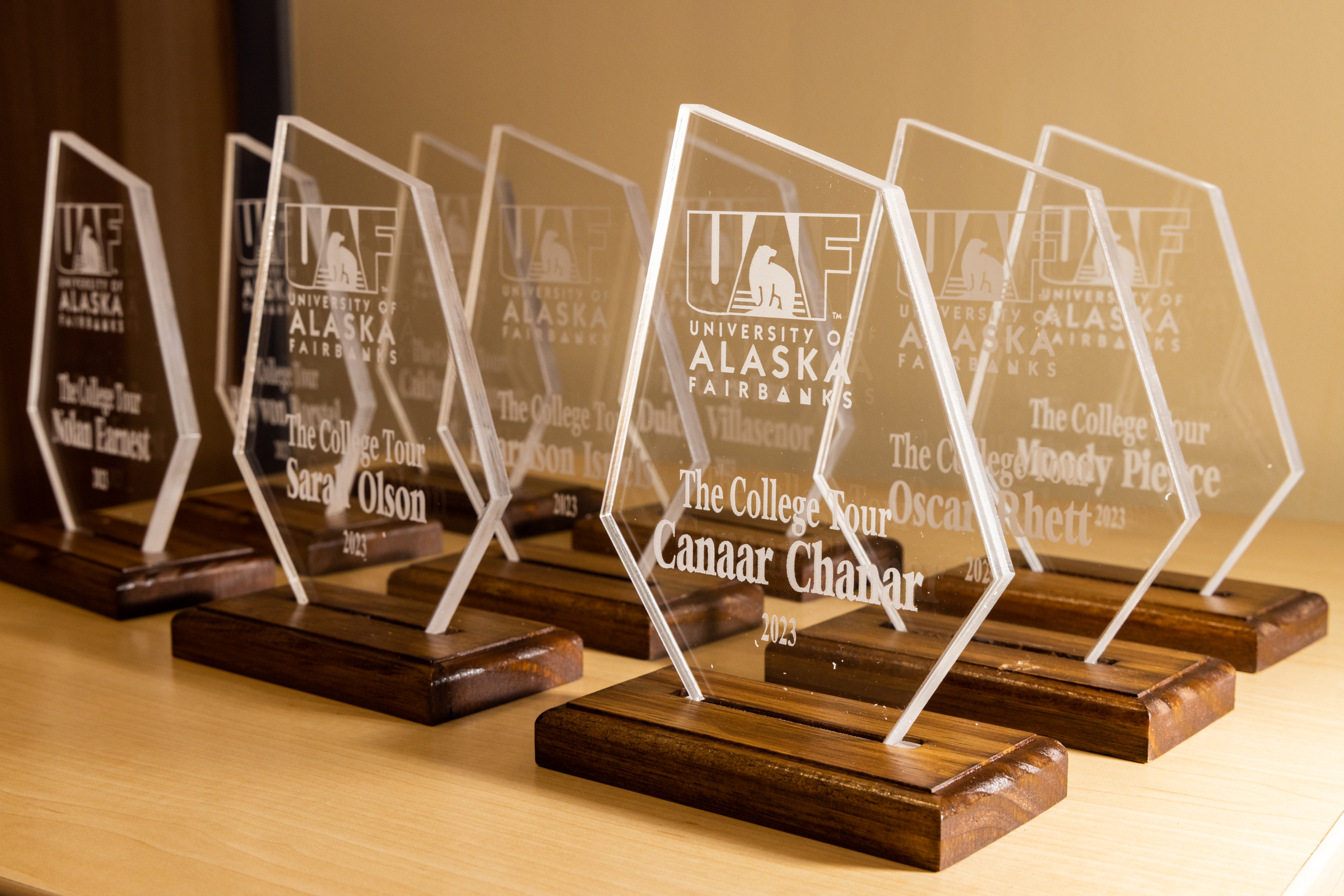 clear diamond-shaped trophies with wood bases