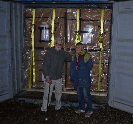 Dr. Johannes Erritzoe and Helga Erritzoe stand in front of a shipping container loaded with the Erritzoe bird collection headed for the University of Alaska Fairbanks.