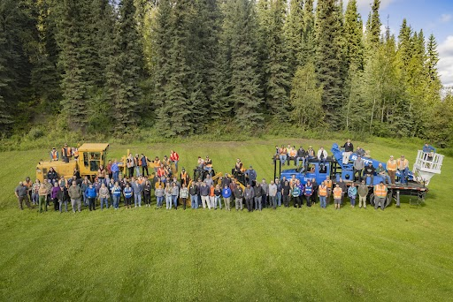 Facilities Services staff gather at the entrance of the Lower Troth Yeddha' Campus near the below 40 sign for a photo on Aug. 20, 2024.