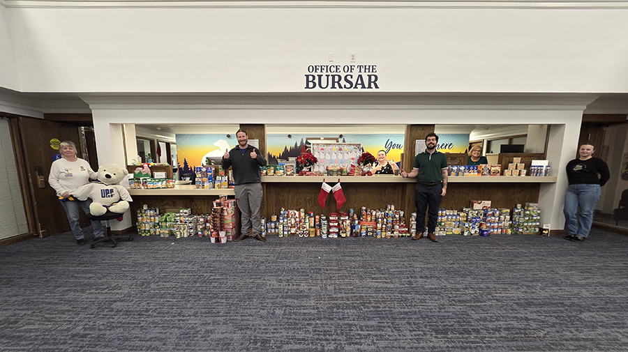 The UAF Office of the Bursar team with its 2025 Food for Fines collection.