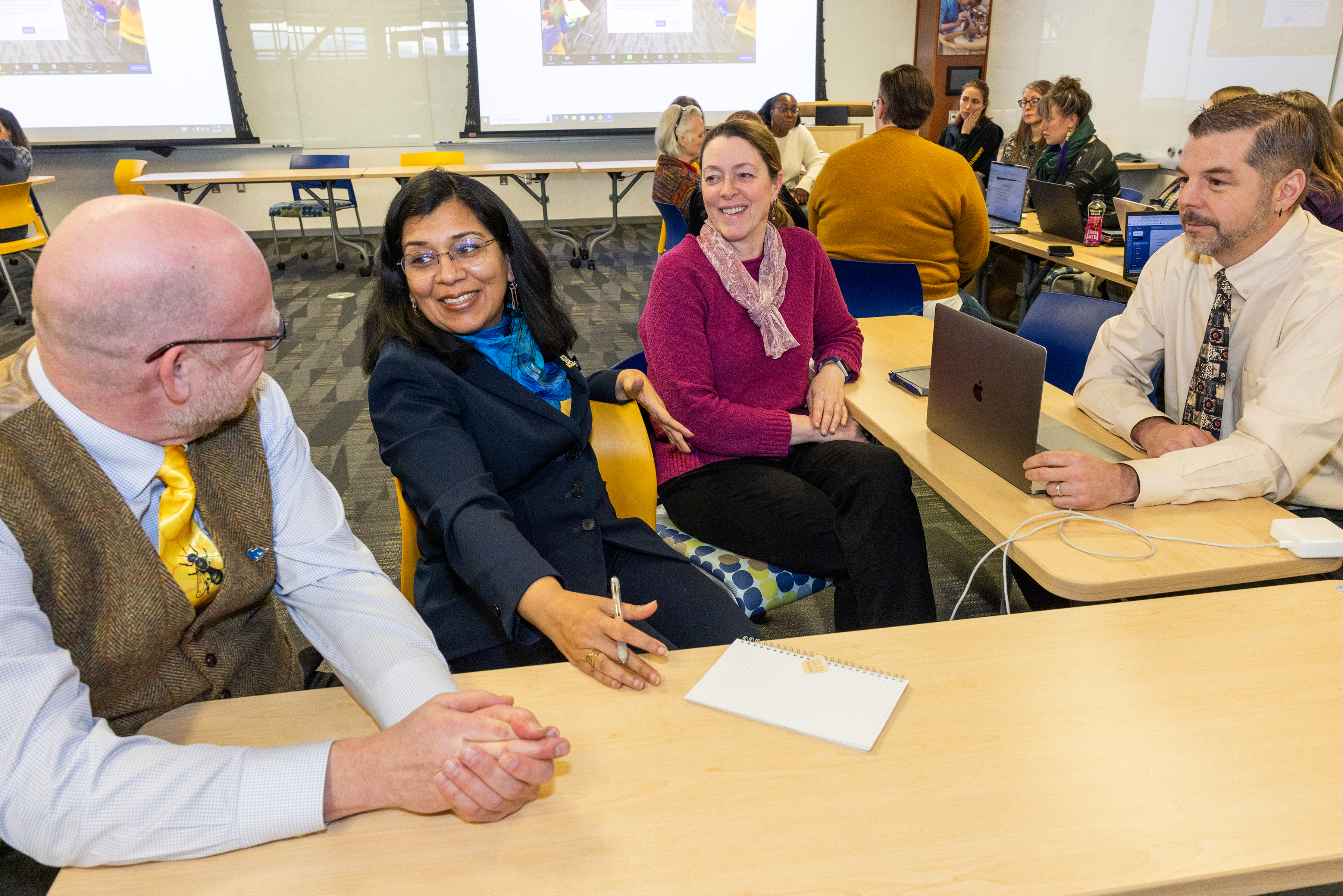 Employees engage in planning discussions at UAF.