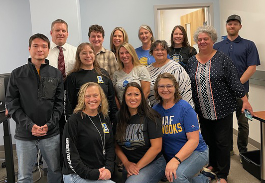 Signers' Business Office team members gather during a recent visit.