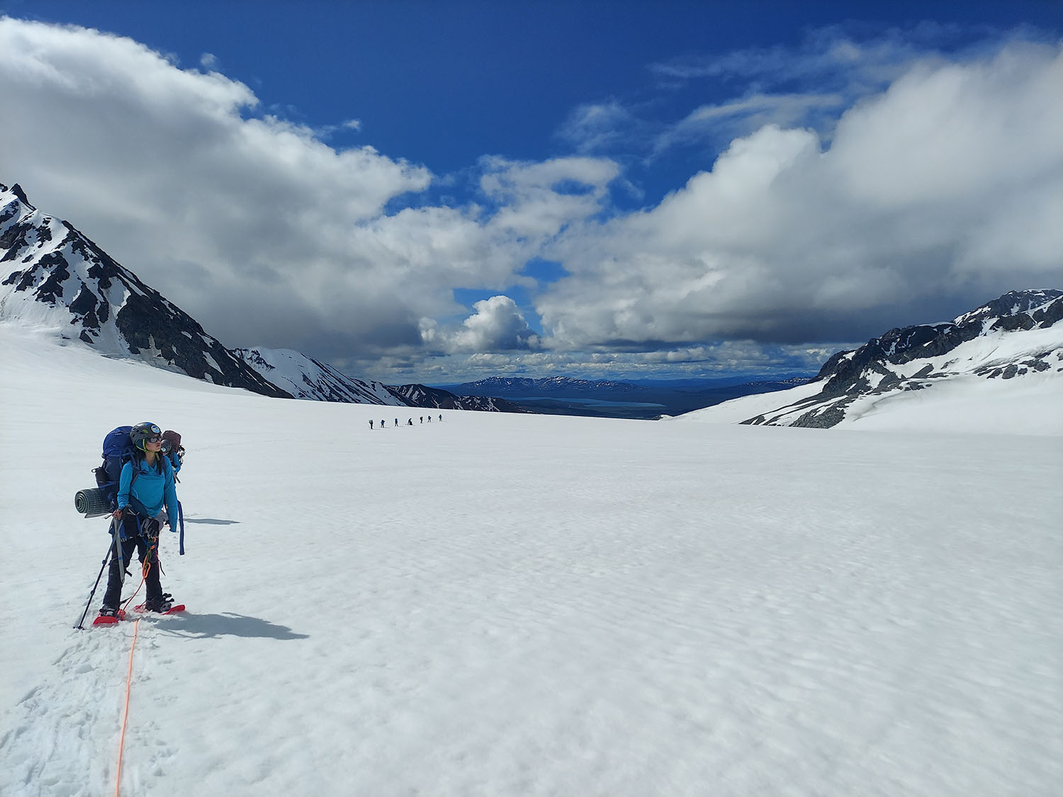 Participants travel in rope teams to their next destination on a glacier.
