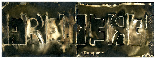 “Arbeit Macht Frei” - Work Makes You Free - Third Reich, 2016, 3.25’’x9’’ Chemigram Print on expired Kodabromide. Photo by J. Jason Lazarus.