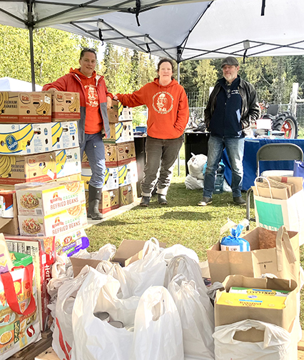 LARS staff stand next to the Locals Day food donations on Sept. 12, 2026.