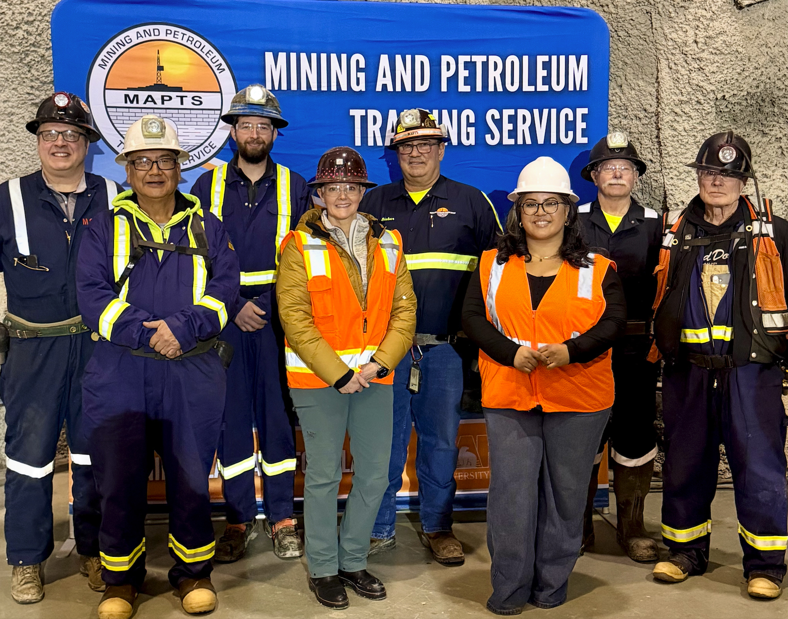 Group photo of the Mining and Petroleum Training Service team. Student Outreach and Enrollment Coordinator Natasha Sison is third from the right.