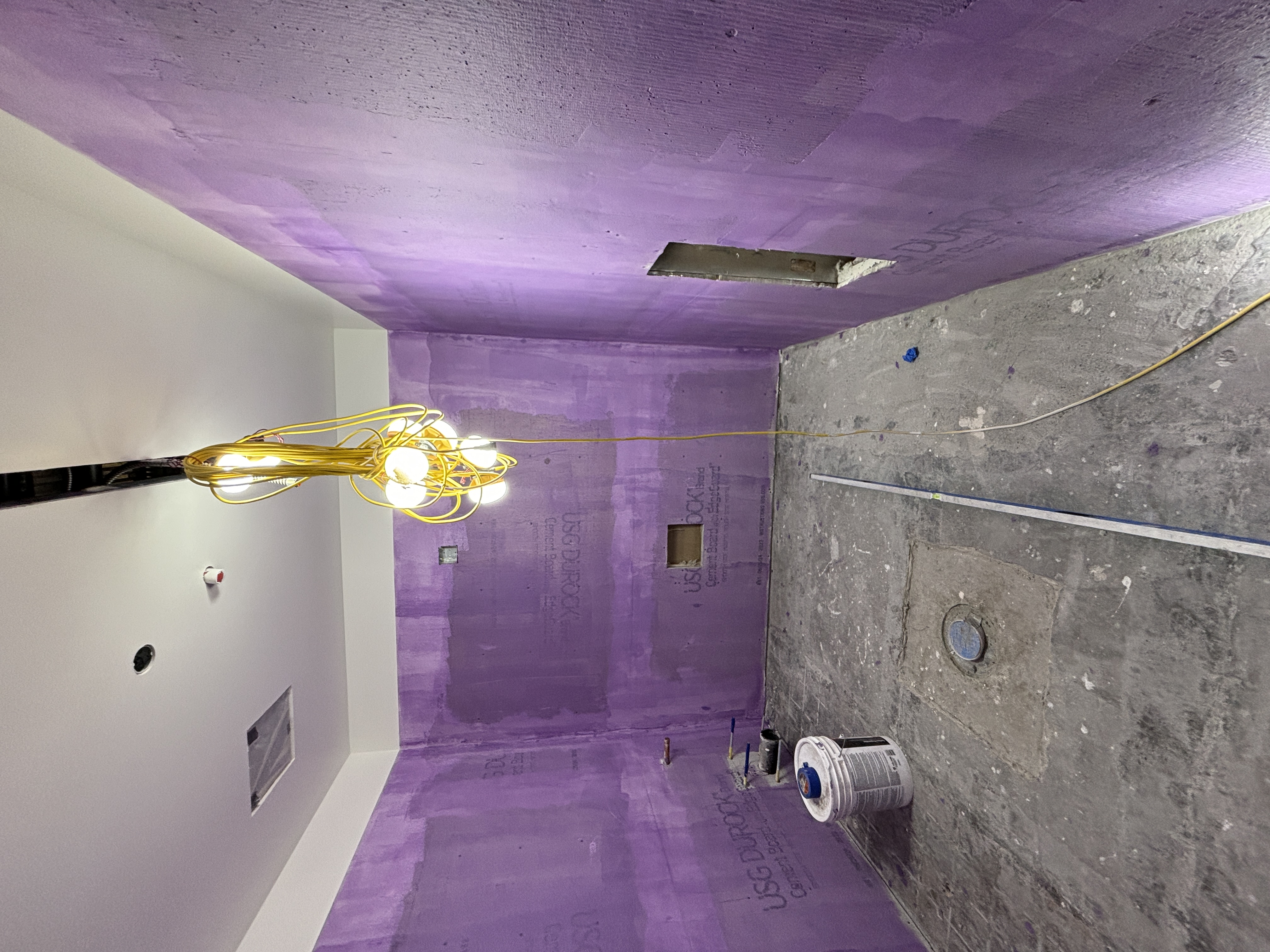 Restroom walls have been constructed and prepared for tiling.