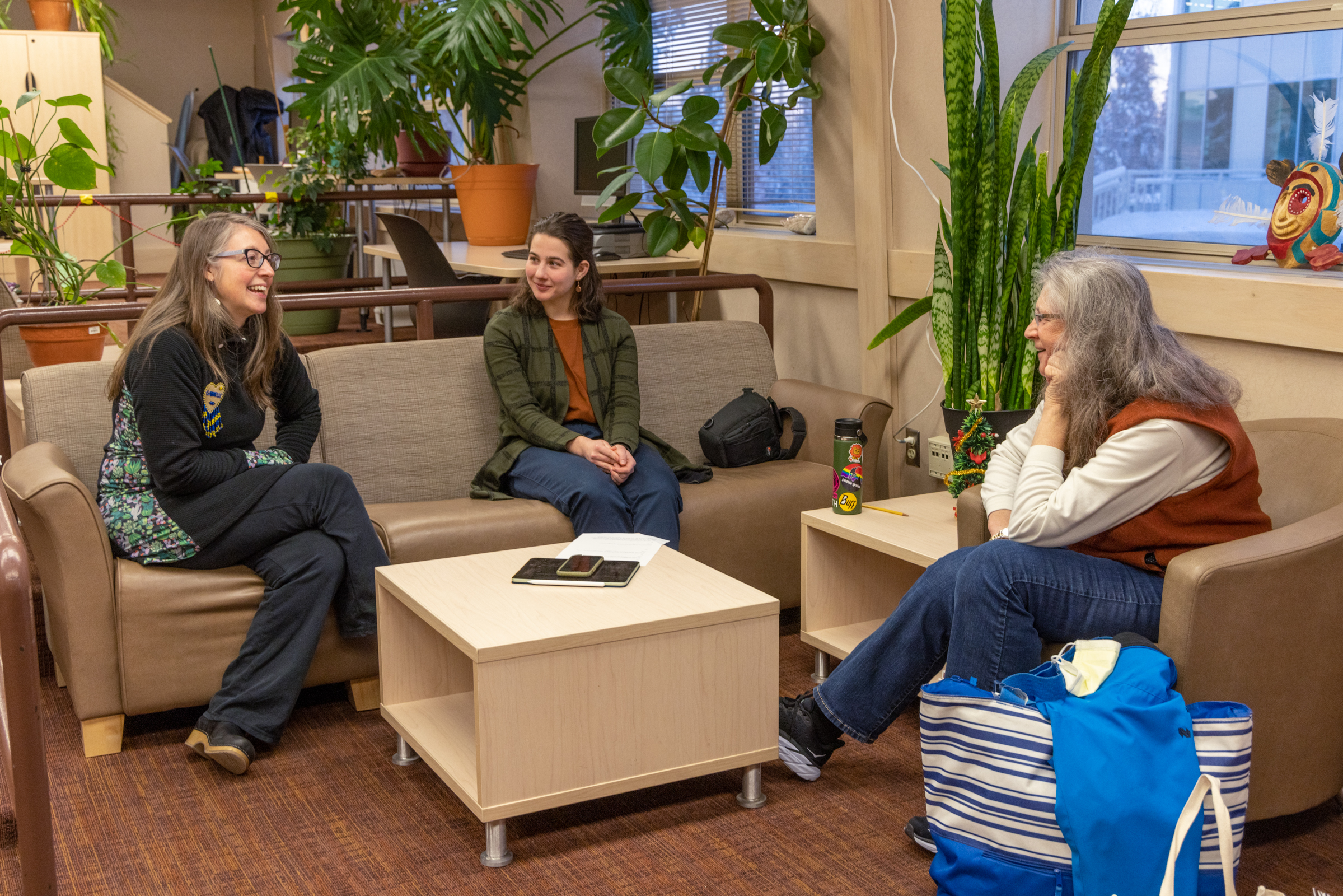 Employees get together and talk on the Troth Yeddha' Campus.