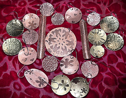 An example of earrings students will make in the Flashy Textured Earrings course.