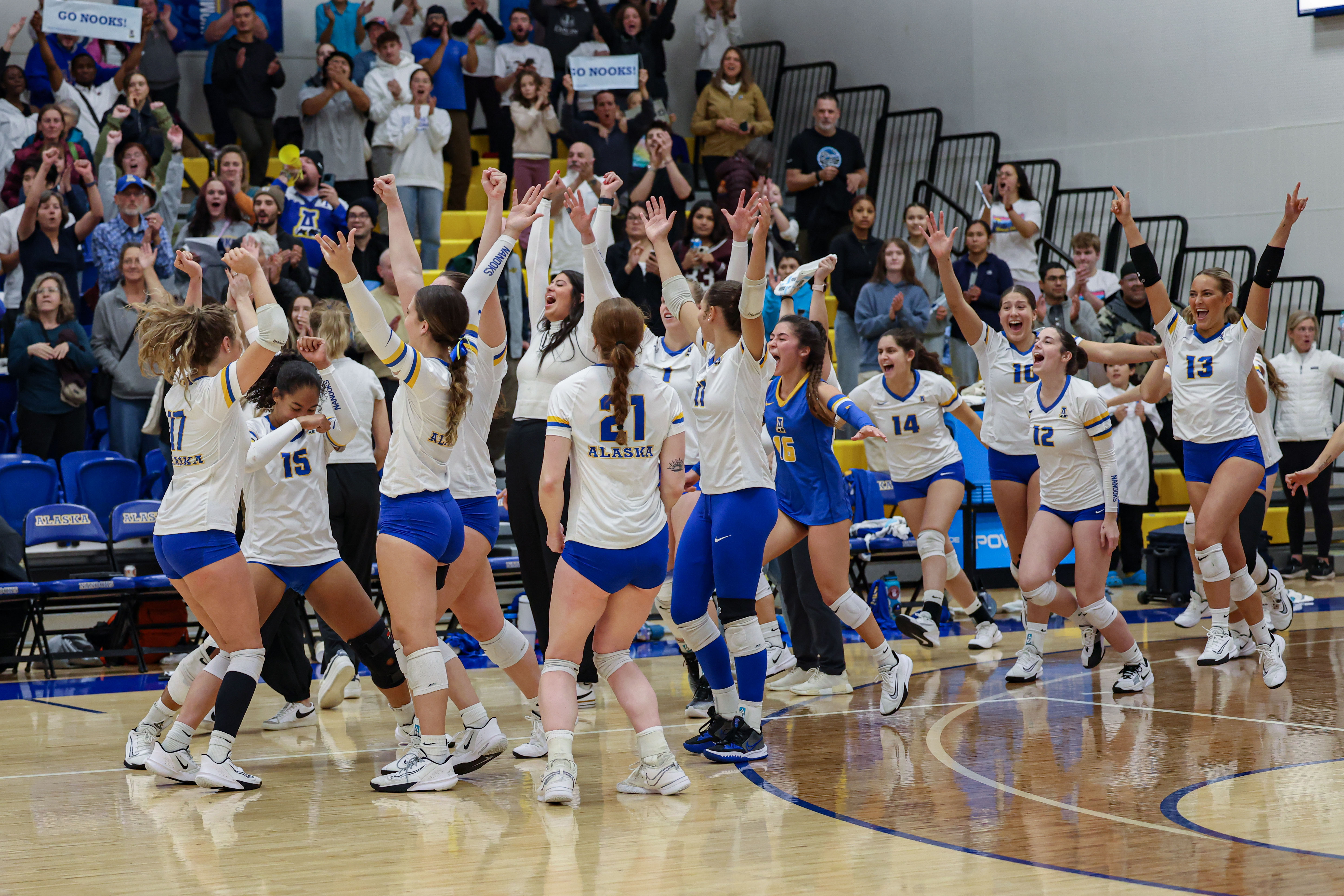 The Nanooks Volleyball team celebrates a win against UAA.