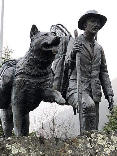 Trail Blazers statue of an early trailblazer prospector and his dog installed at Mile 0 in Seward, Alaska, by the Seward Iditarod Trail Blazers in 2012 to commemorate the 100th anniversary of the Iditarod Trail (1908-2008).