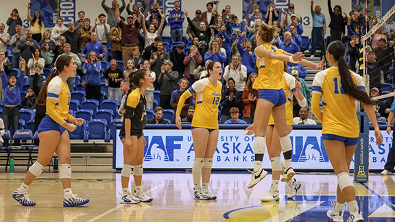 The Nanooks volleyball team celebrates after scoring a point against an opponent during a game at the Alaska Airlines Gymnasium in the Patty Center.