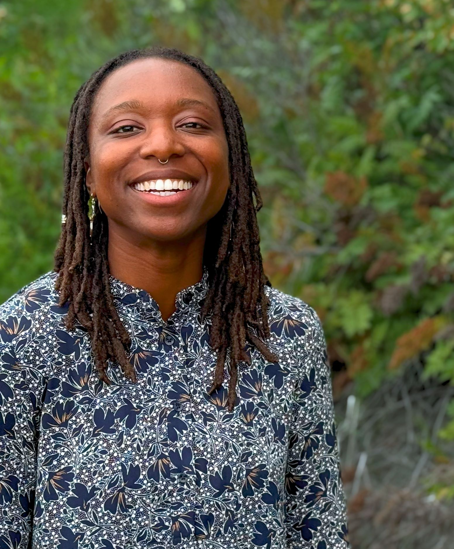 woman laughs facing camera