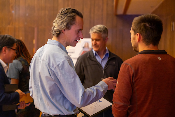 Mingling at the award table