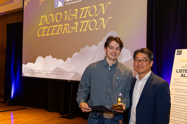 Tate Barhaug accepting his award for best staff disclosure
