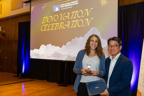 Maegan Weltzin with trophy and David Park