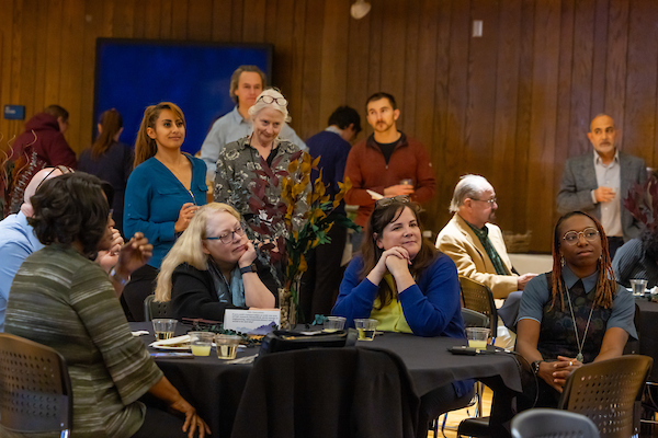 Guests listen intently