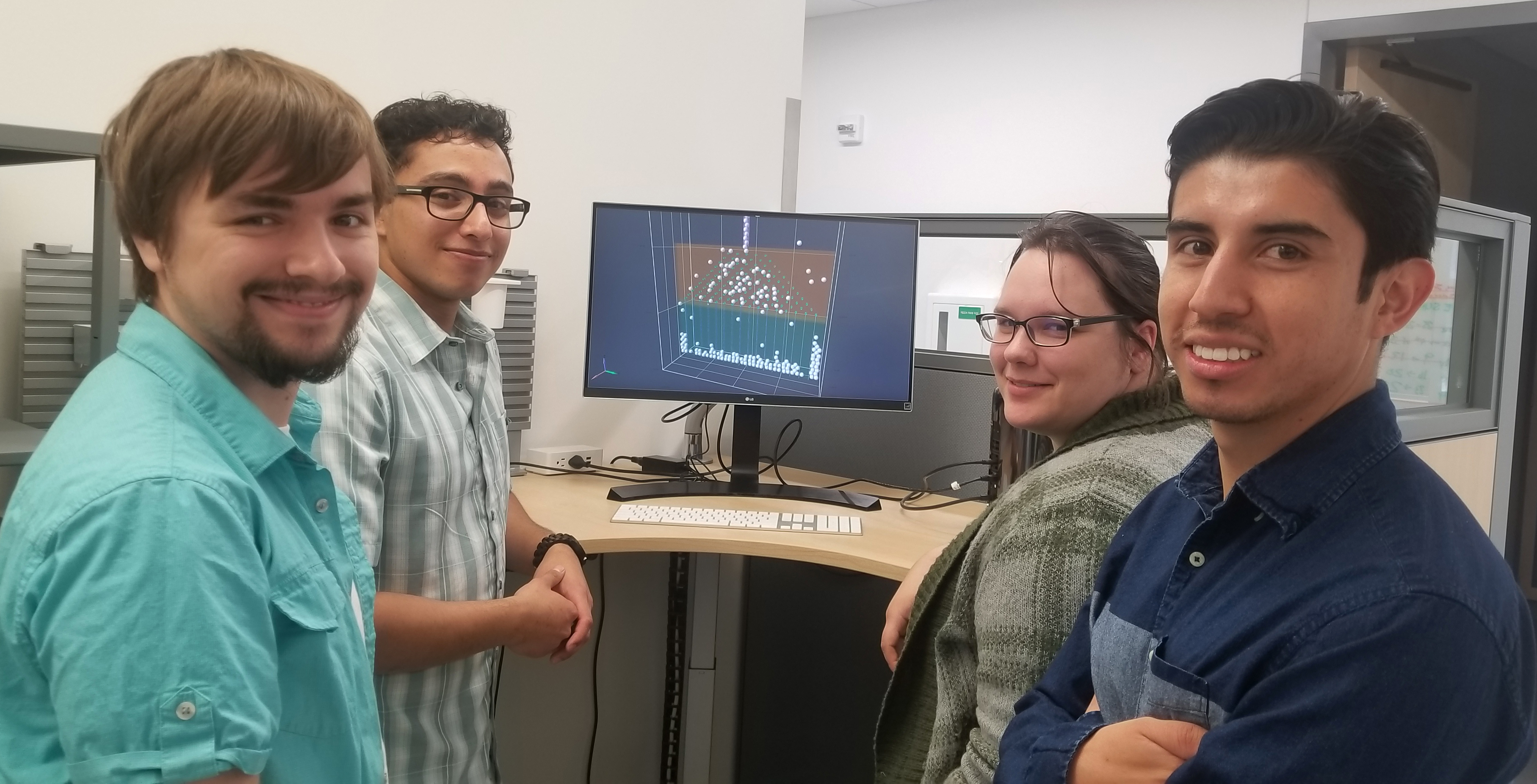 Coupi interns from let Tristan Craddick, Luis Merques, Patricia Gerdes, and David Schweigert are working on moving the Coupi software closer toward commercialiization. Photo by Amanda Byrd.