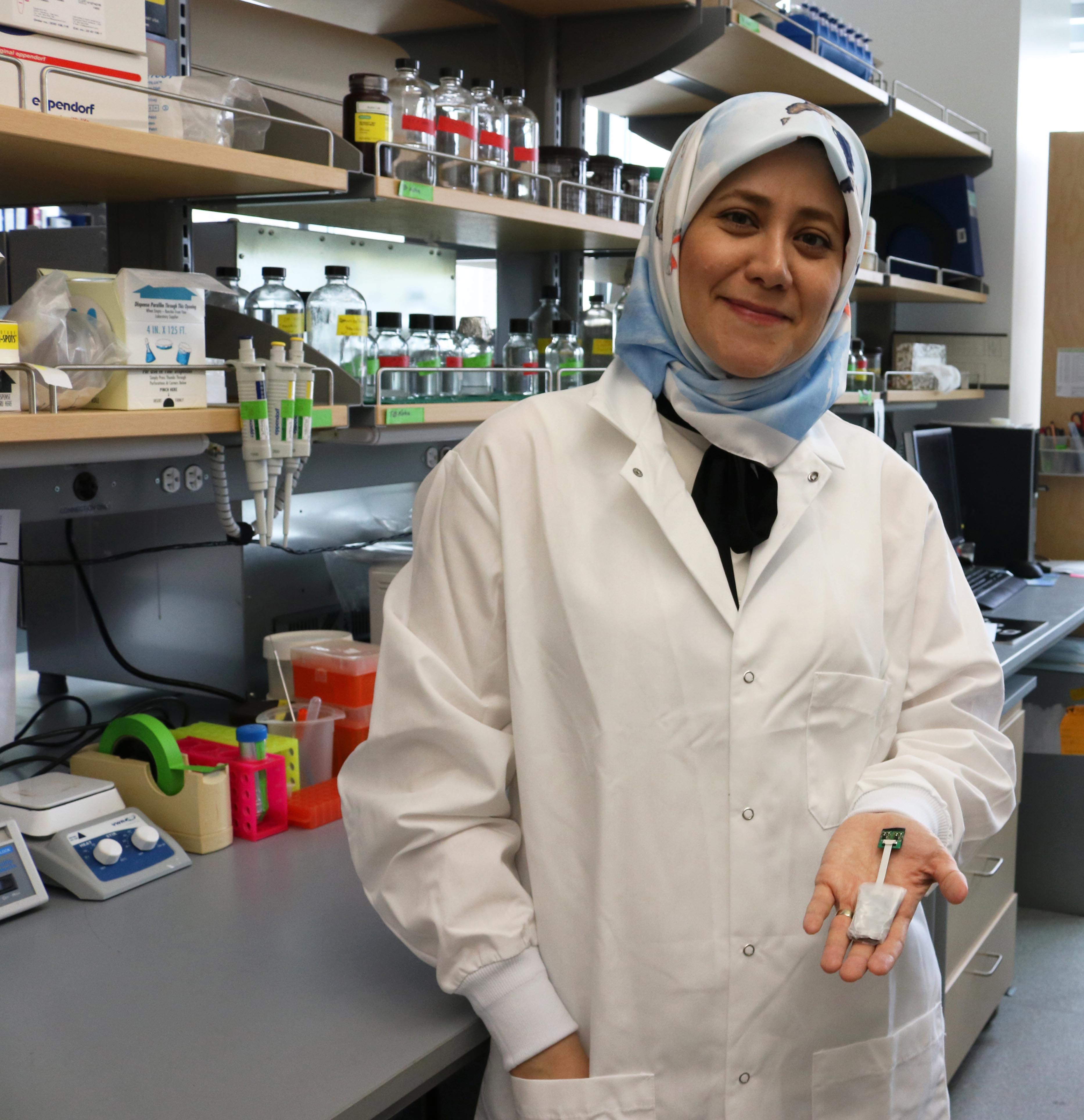 Bahareh Barati holds her prototype of a brain imaging device she devopled at UAF. Photo by Amanda Byrd.