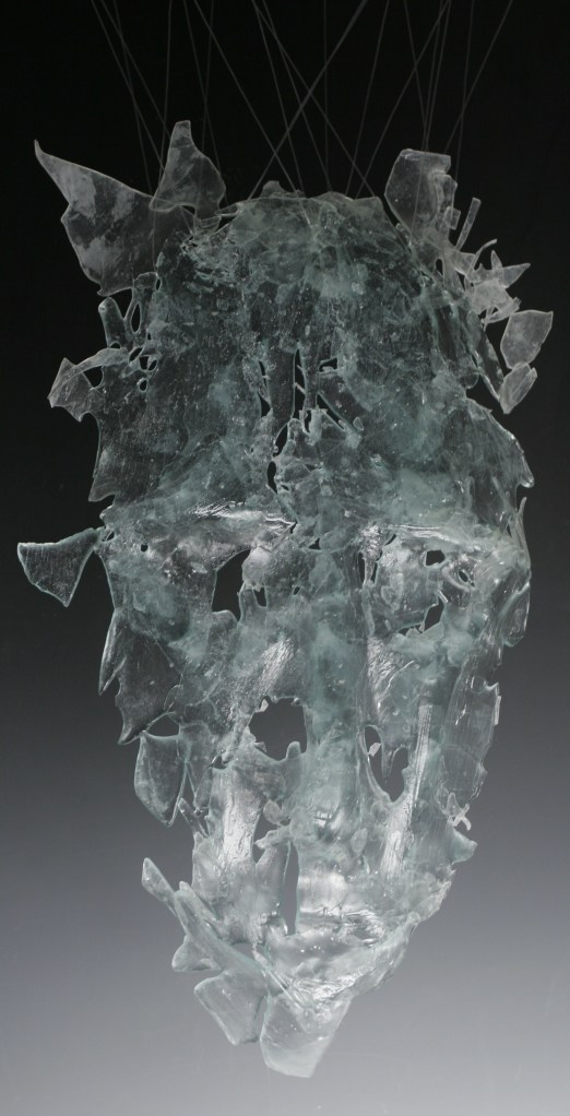 glass mask sculpture by Joel Isaak