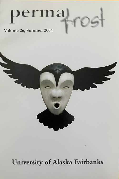 Black and white carving of mask with wings