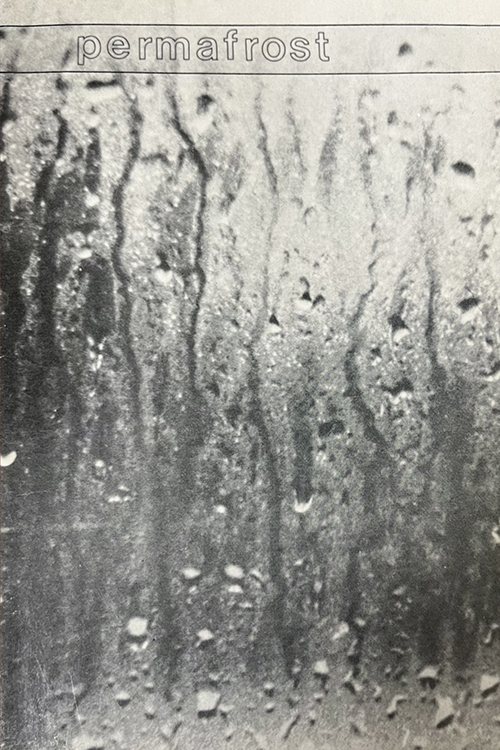 black and white image of raindrops on a window