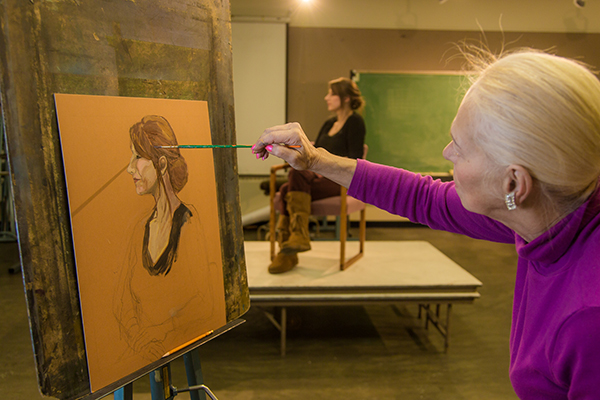 Peggy Swartz at work during the portrait painting class in the UAF Fine Arts complex, offered during Wintermester 2014. | UAF Photo by Todd Paris