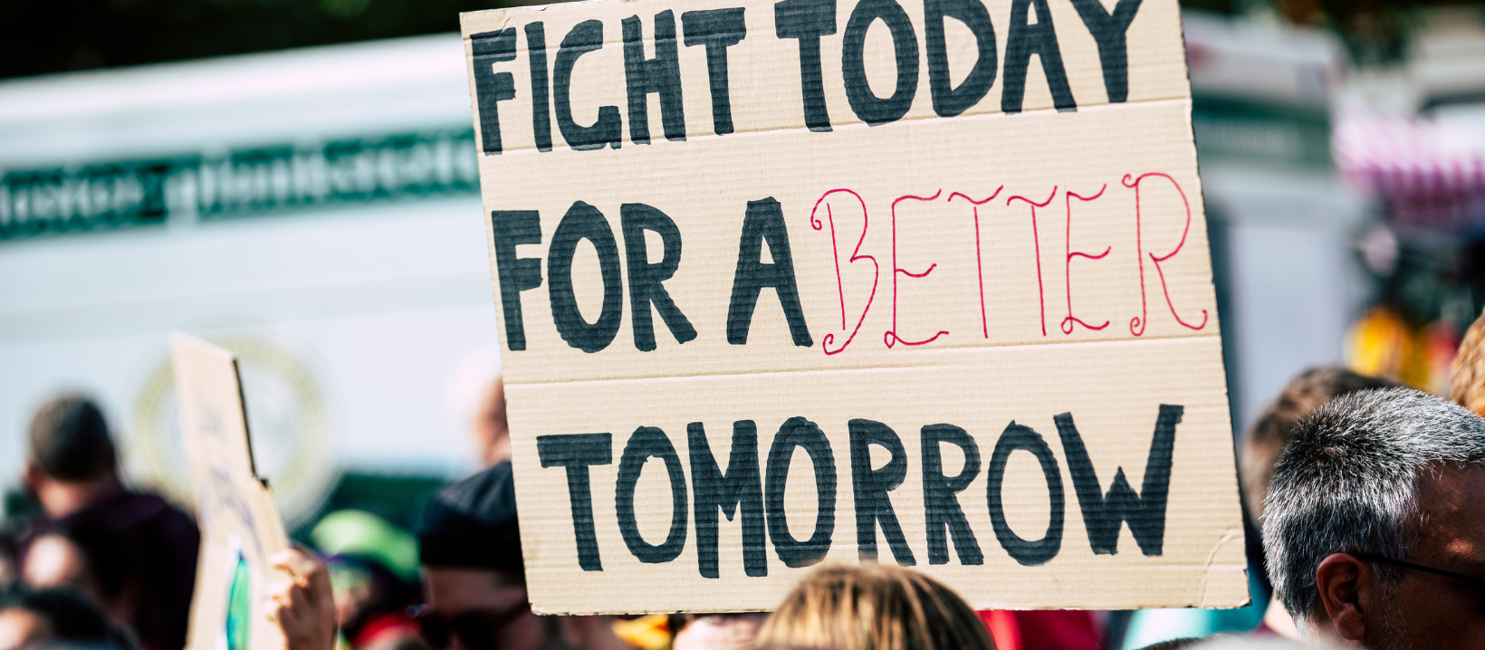 Rally with sign "Fight Today for a Better Tomorrow"