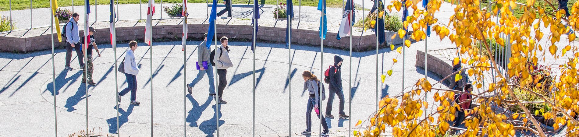 Students crossing University of Alaska campus on a fall day.