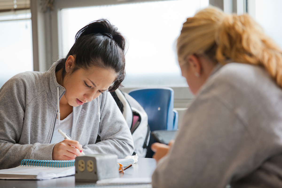 Shannon Kim, left, and Rose Mattson spend a few minutes prepping for a quiz in their summer sessions anatomy and physiology class in a Bunnell Building lab. | UAF Photo by Todd Paris