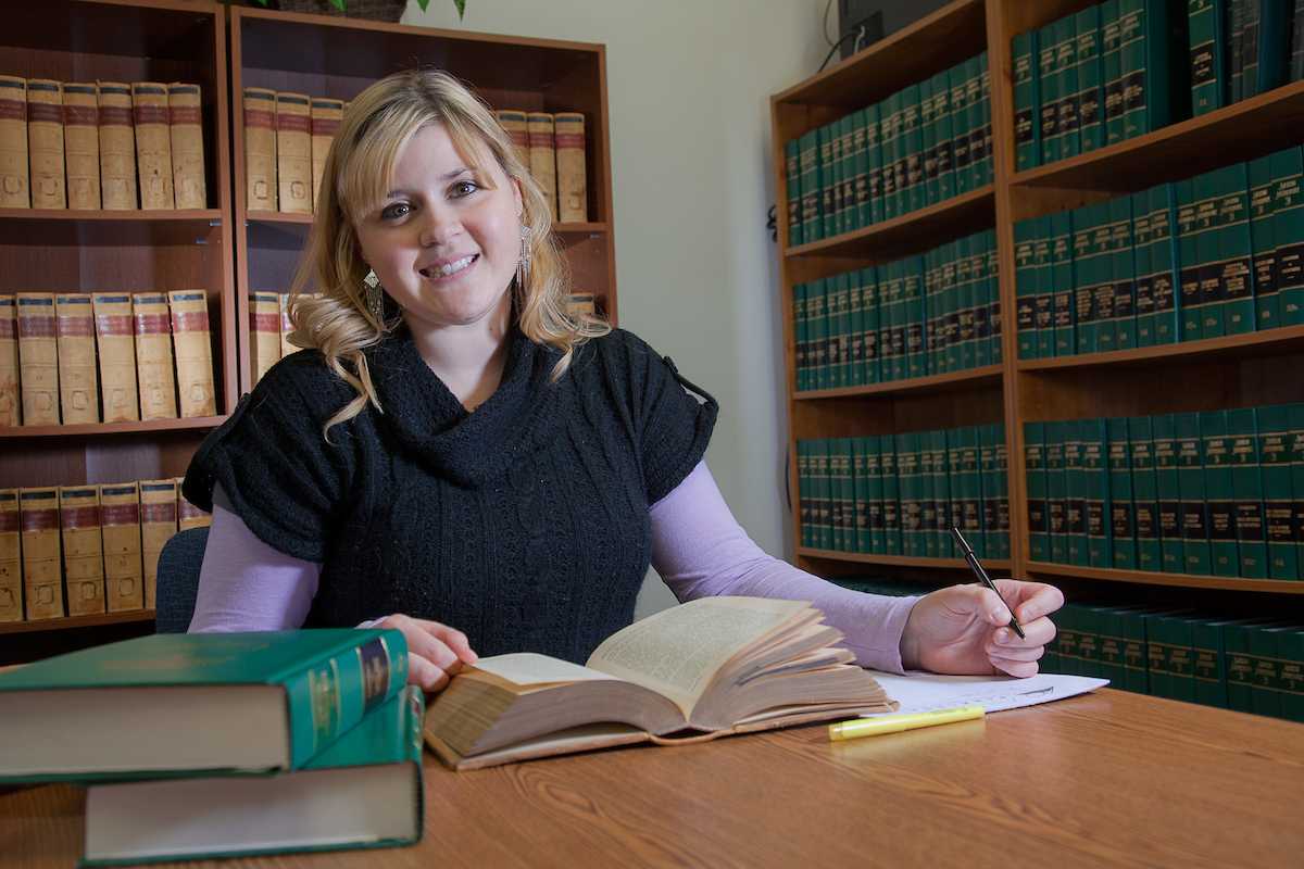 Tara Bourdeau conducts some research for her paralegal studies class at CTC's law library. | UAF Photo by Todd Paris