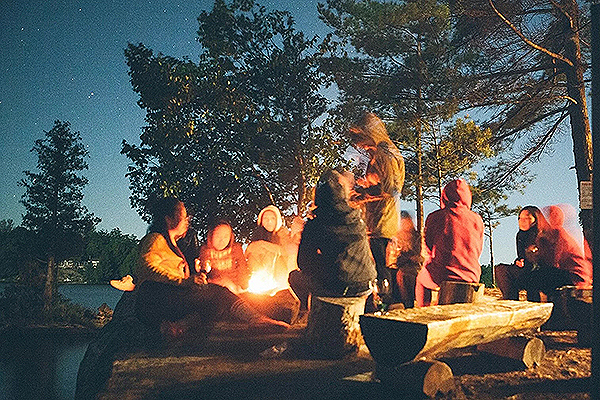 People sitting around a campfire