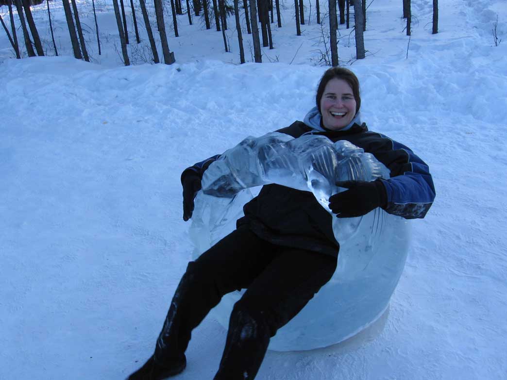 Dani Sheppard sitting in a seat sculpted from ice. Photo courtesy of Sheppard