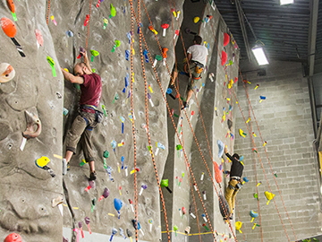 A climber at the UAF indoor rock climbing wall
