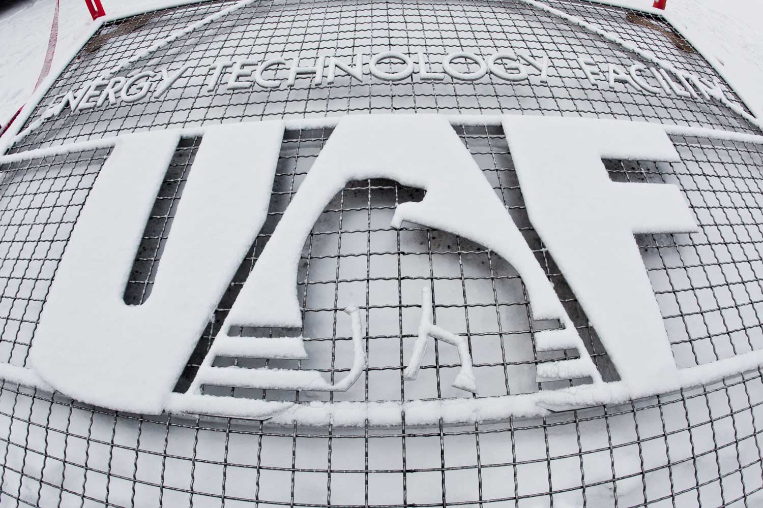 Snow covered sign at the UAF Energy Technology Facility