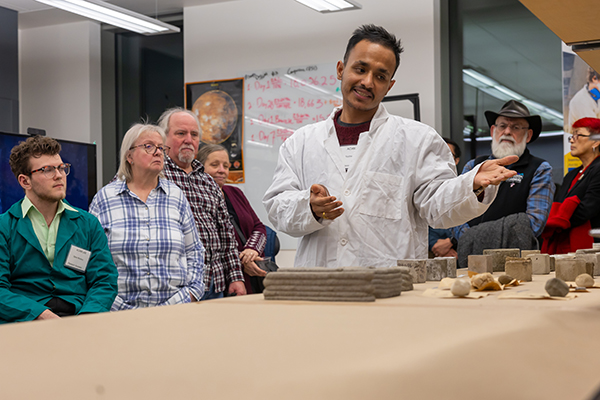 ACAM graduate research assistant Nishesh Chhetri talks about the the lab's research with 3D printed concrete as the Institute of Northern Engineering celebrates it's 40th Anniversary with the INE.