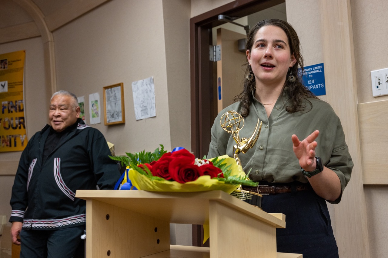 Maggie King delivers words after accepting the presentation of the Emmy award in the Brooks Building Gathering Room.