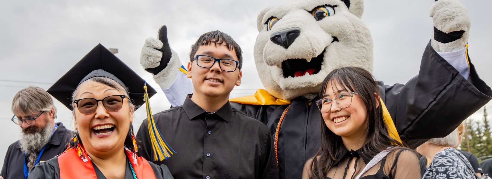 Graduate celebrates with Nook and her family. 