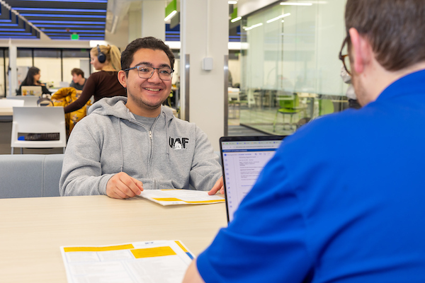 A student meeting with an enrollment coach at the Student Success Center
