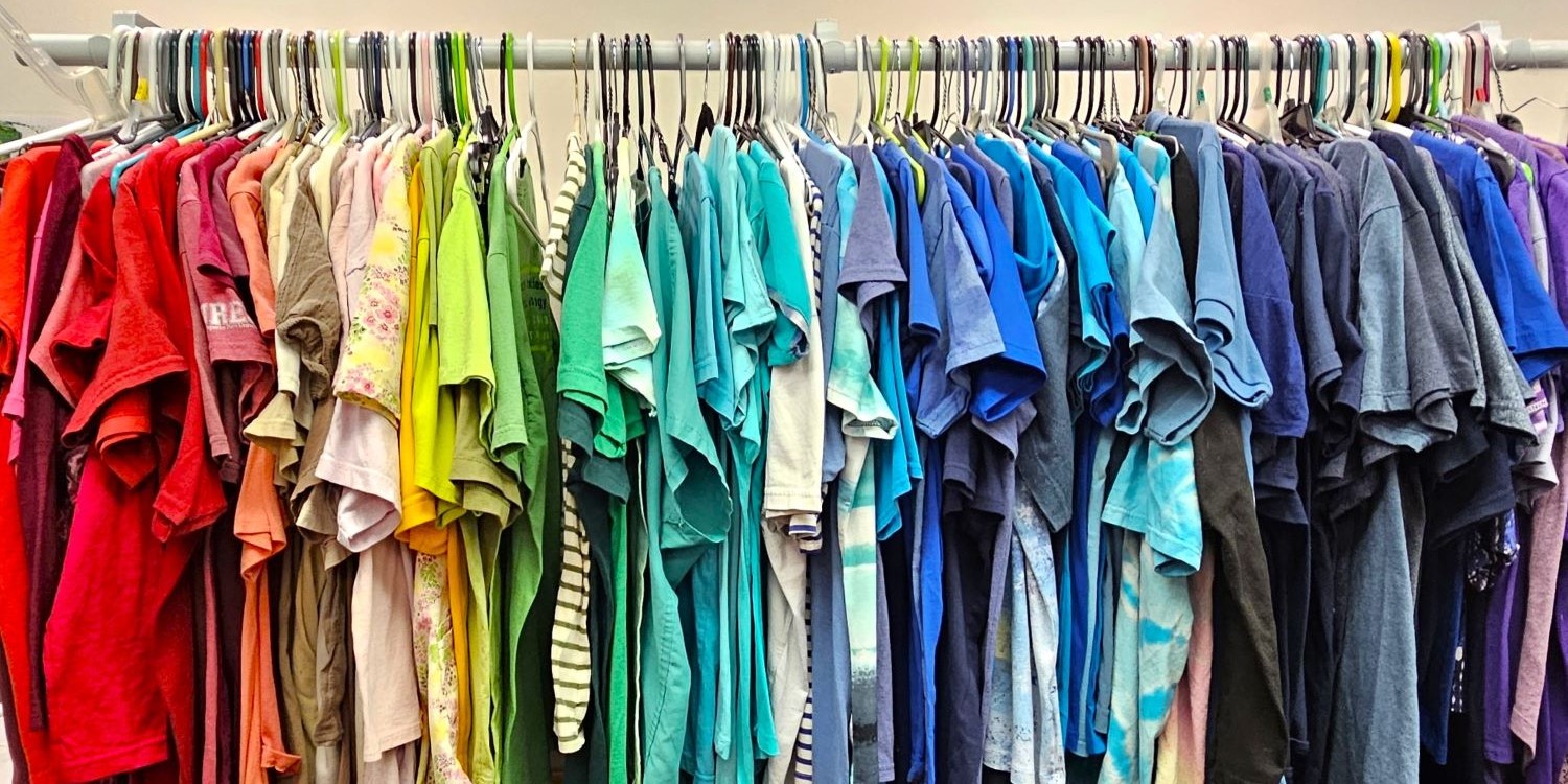 colorful t-shirts hanging on a rack