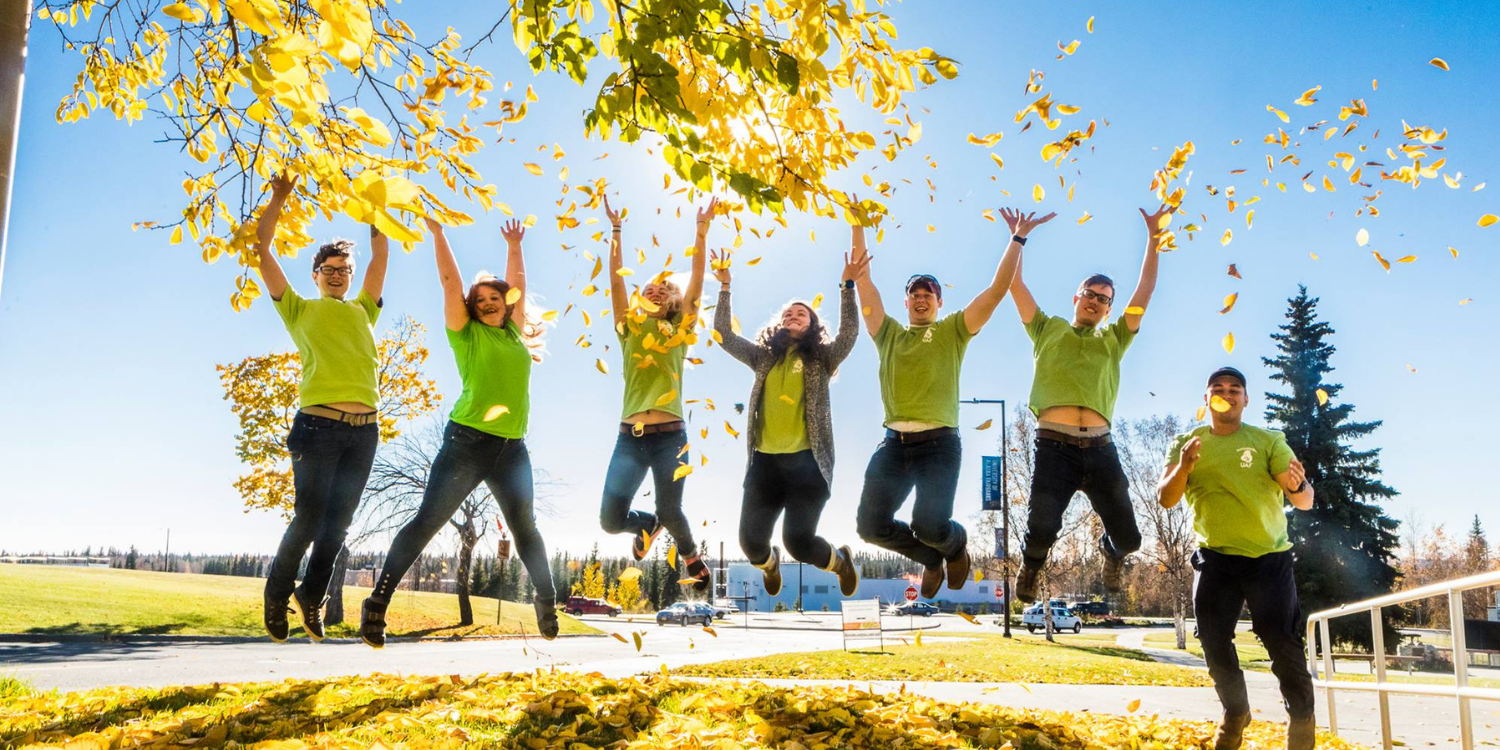 Group photo of students jumping