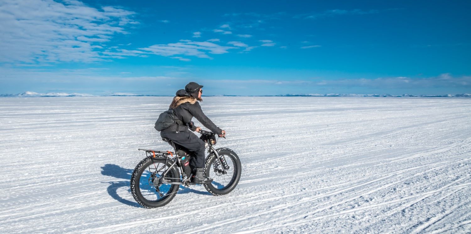 Person riding a bike on the snow